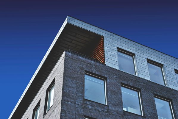 Modern residential building with a blue sky.